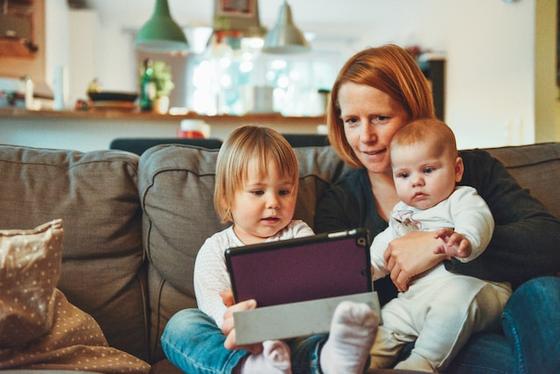 a mother reading to her children